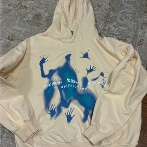 Aelfric Eden Cream Hoodie with Blue Hand Graphic